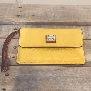 Genuine leather yellow Dooney and Bourke wallet wristlet